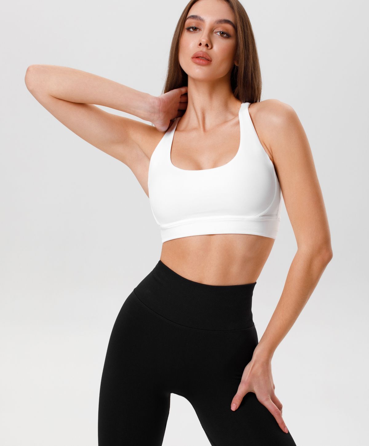 Model in athletic attire posing confidently.