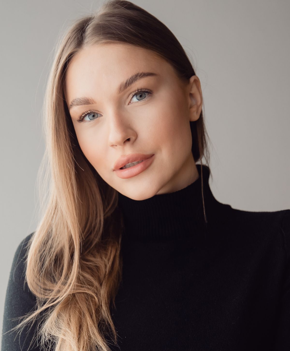 Portrait of a woman with long, light hair.