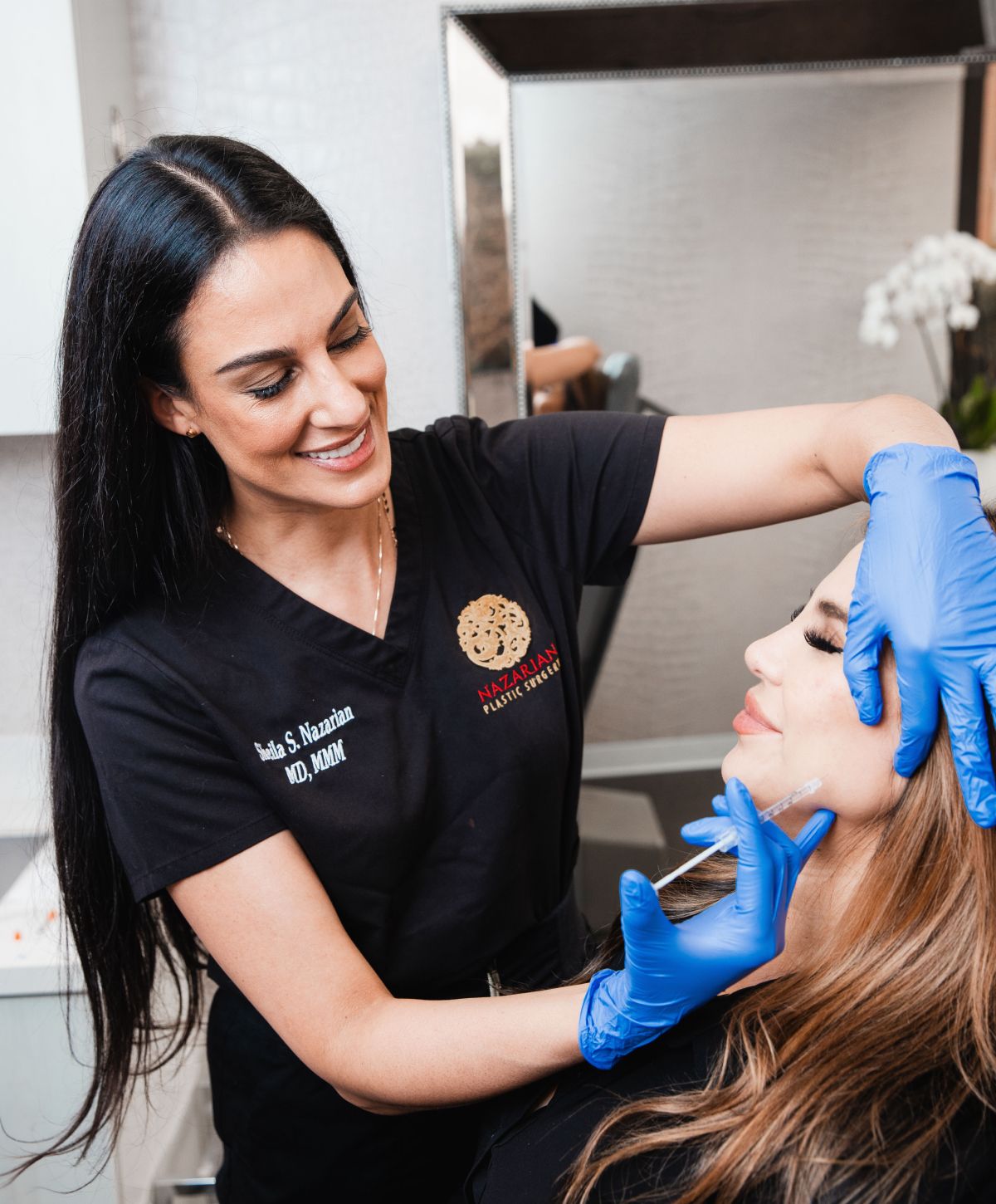 Medical professional administering cosmetic treatment to client.