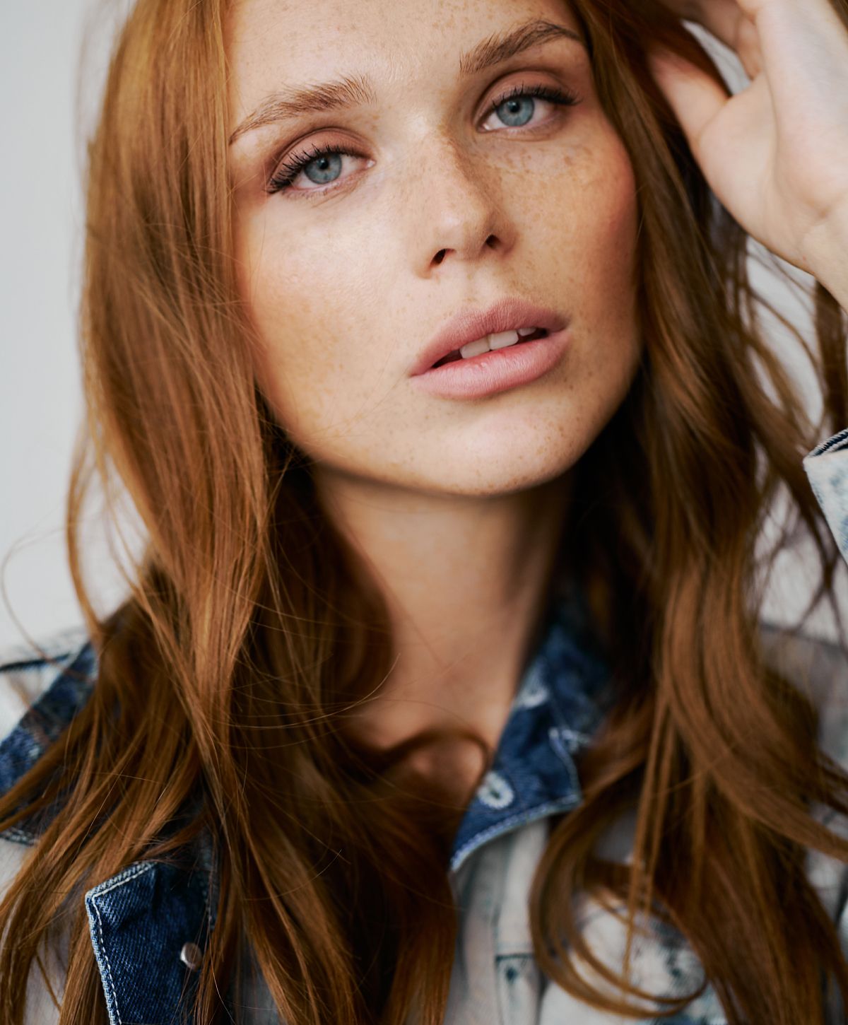 Close-up of a woman with red hair.