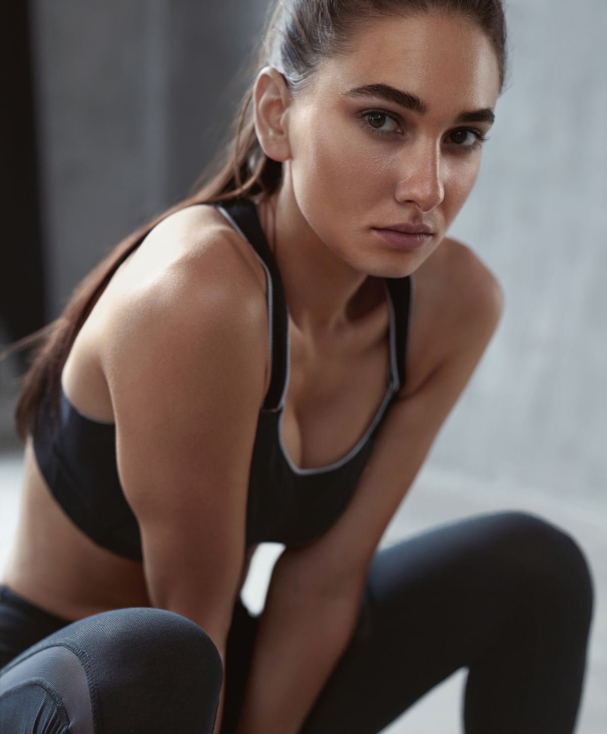 Athlete in sporty attire, focused expression.