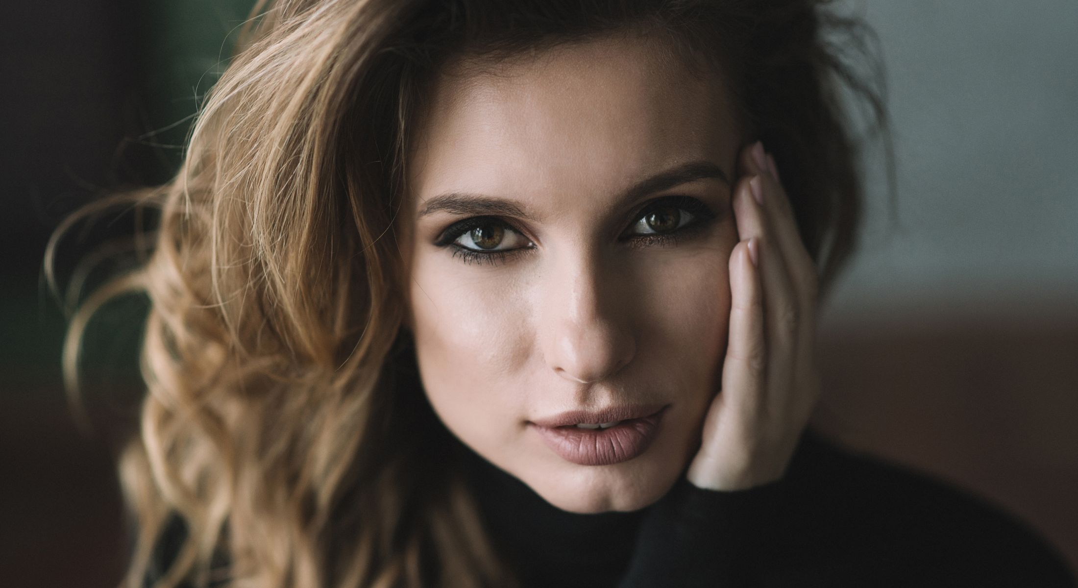 Close-up of a woman with flowing hair.